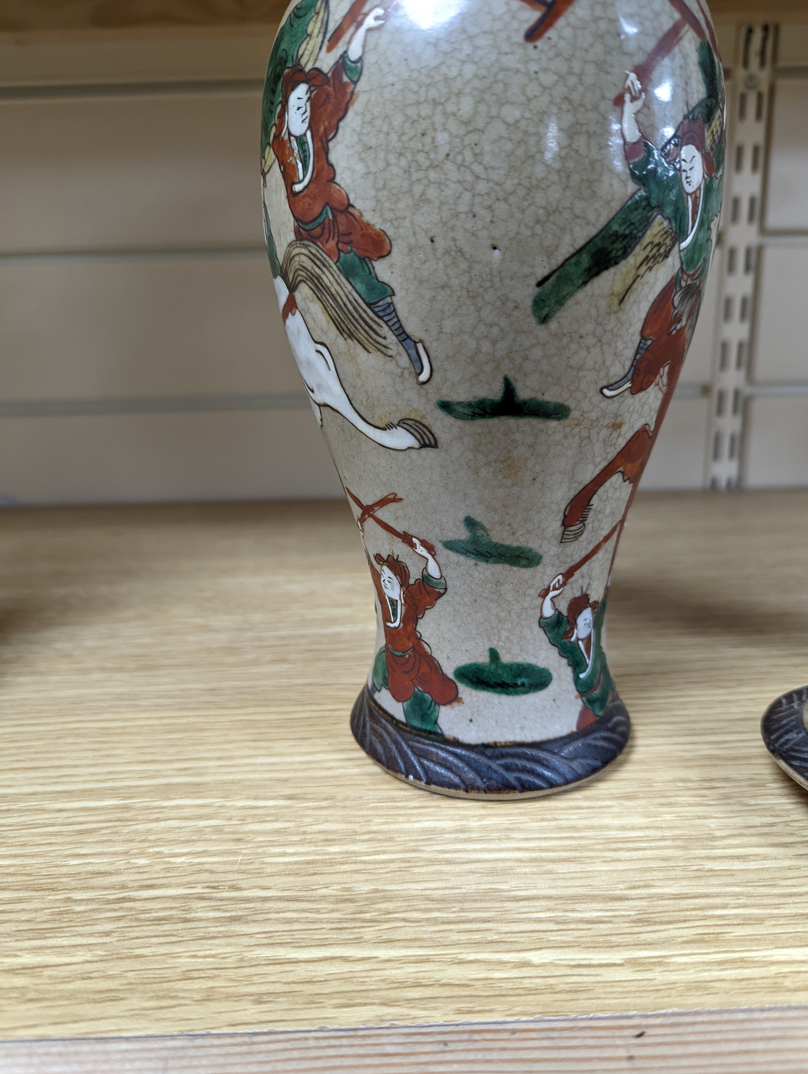 A late 19th century Chinese crackle glaze famille rose baluster vase and cover 30cm